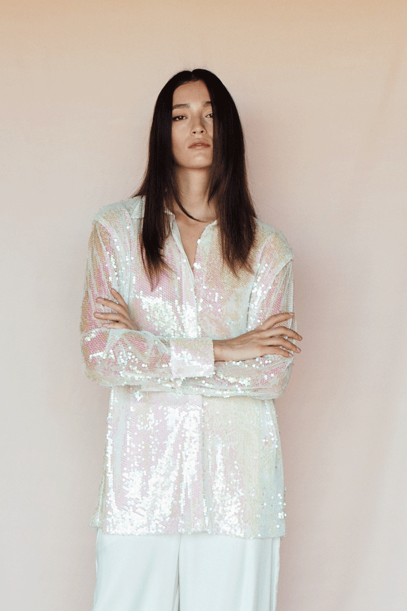 Sequined oversize shirt featuring a lining, classic collar, front hidden shell buttons, dropped shoulders, long sleeves, and shell buttons on cuffs